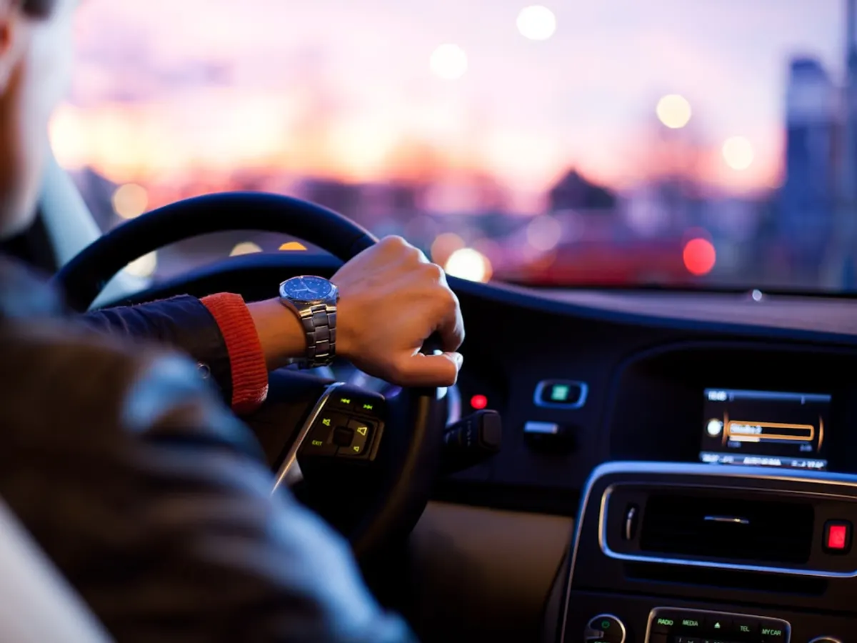 Driving school website shown on a phone with course packages, instructor profiles and a WhatsApp enrollment button (Jhang)