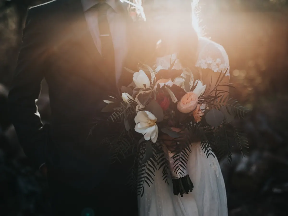Event planner website shown on a phone with a photo gallery of past events, service packages and a WhatsApp booking button (Gujrat)