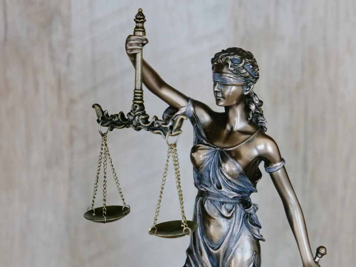 Law firm website shown on a laptop with practice areas, lawyer profiles and bar council credentials